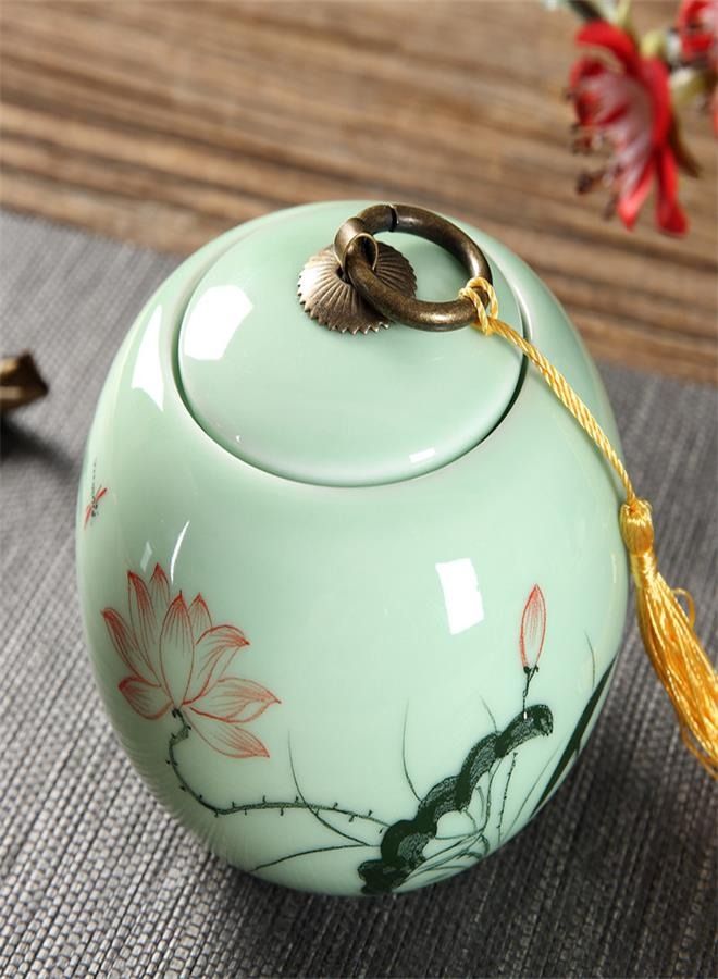Ceramic Gongfu Tea Canister with Hand-painted Lotus Design: Aesthetic and Functional Tea Leaf Storage Jar, crafted in Celadon Porcelain  - Image 1