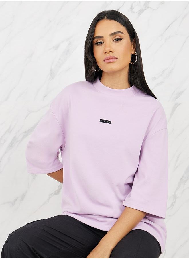 Oversized Patch Detail High Neck Longline T-Shirt with 3/4 Sleeves - pzsku/Z7E2CDB47F22AD6CD854DZ/45/_/1712414828/71495ab9-1144-406e-a51f-df9ffdf73a05