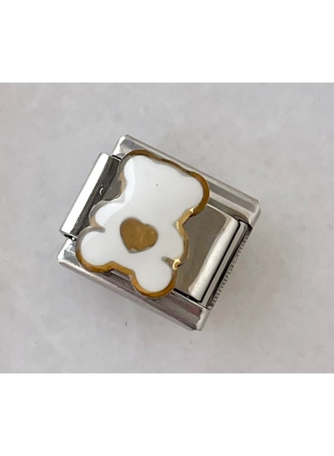 An Italian charm for a white bear bracelet. These charms are known for their flexible and innovative connection mechanism that allows for the creation of custom bracelets.