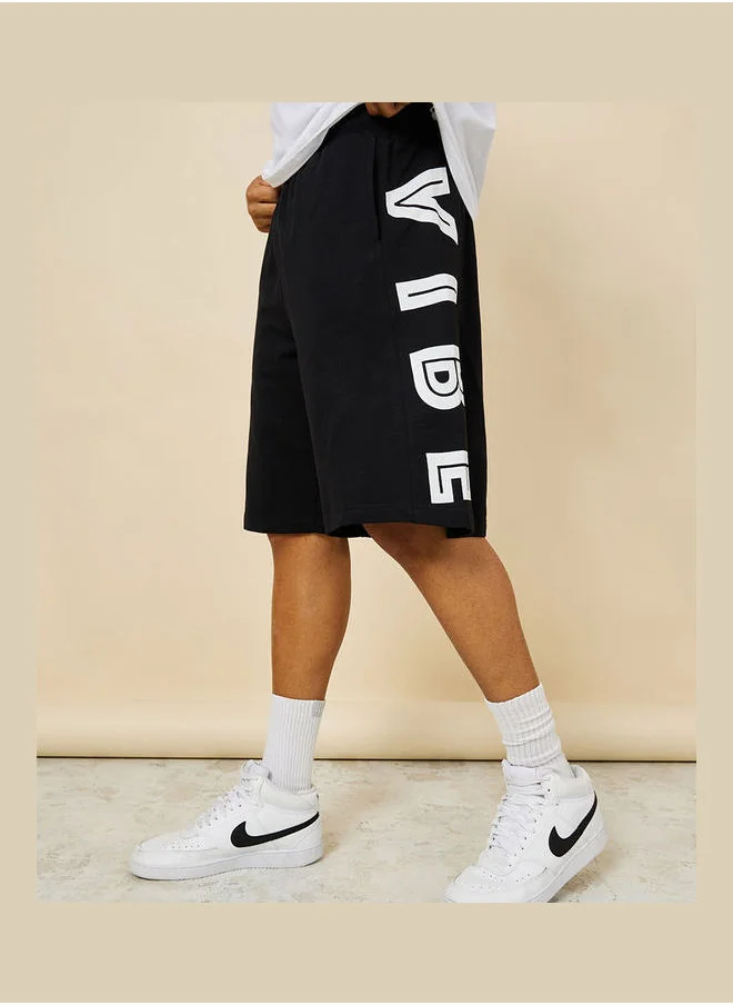 Styli Oversized Terry Shorts with Bold Text Print Detail