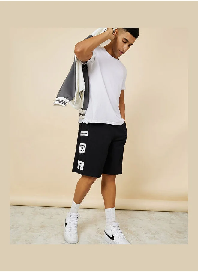 Styli Oversized Terry Shorts with Bold Text Print Detail