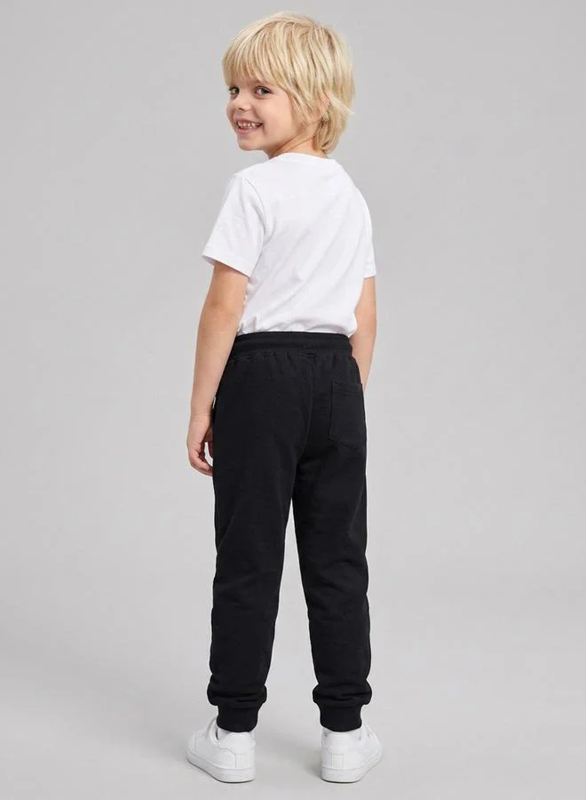 Take Two  Boys Black Graphic Print Cuffed Hem Drawstring Joggers By Juniorloom for Men | Best Price UAE