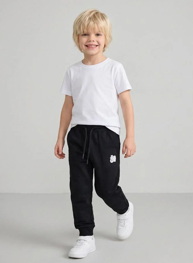 Take Two  Boys Black Graphic Print Cuffed Hem Drawstring Joggers By Juniorloom for Men | Best Price UAE