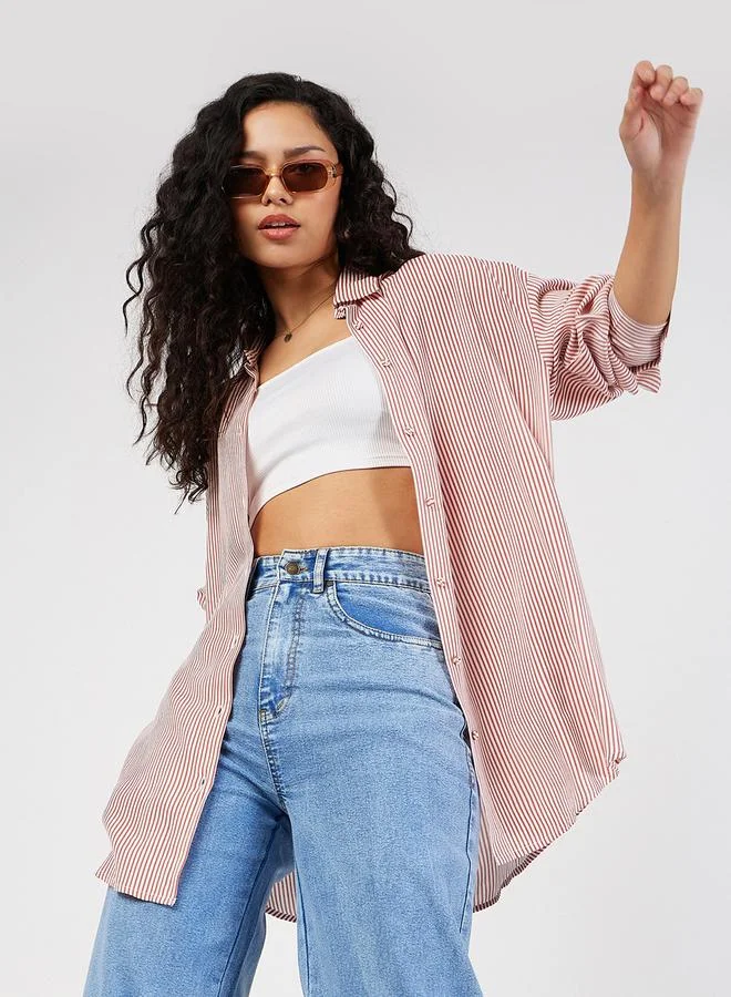 ساسافراس بلوزة واسعة بتفاصيل محزوزة