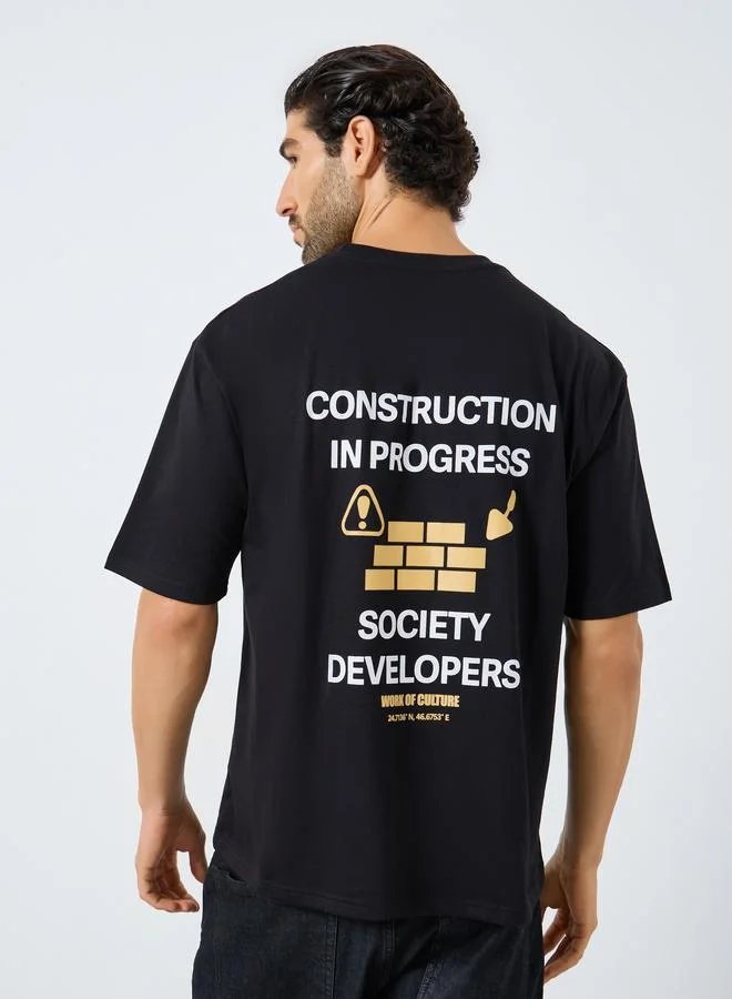 Styli Men Black Slogan Print Oversized T-Shirt