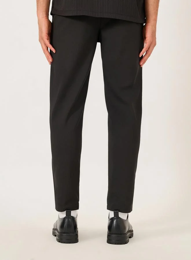 Take Two Solid Slant Pocket Tapered Pants by Styli