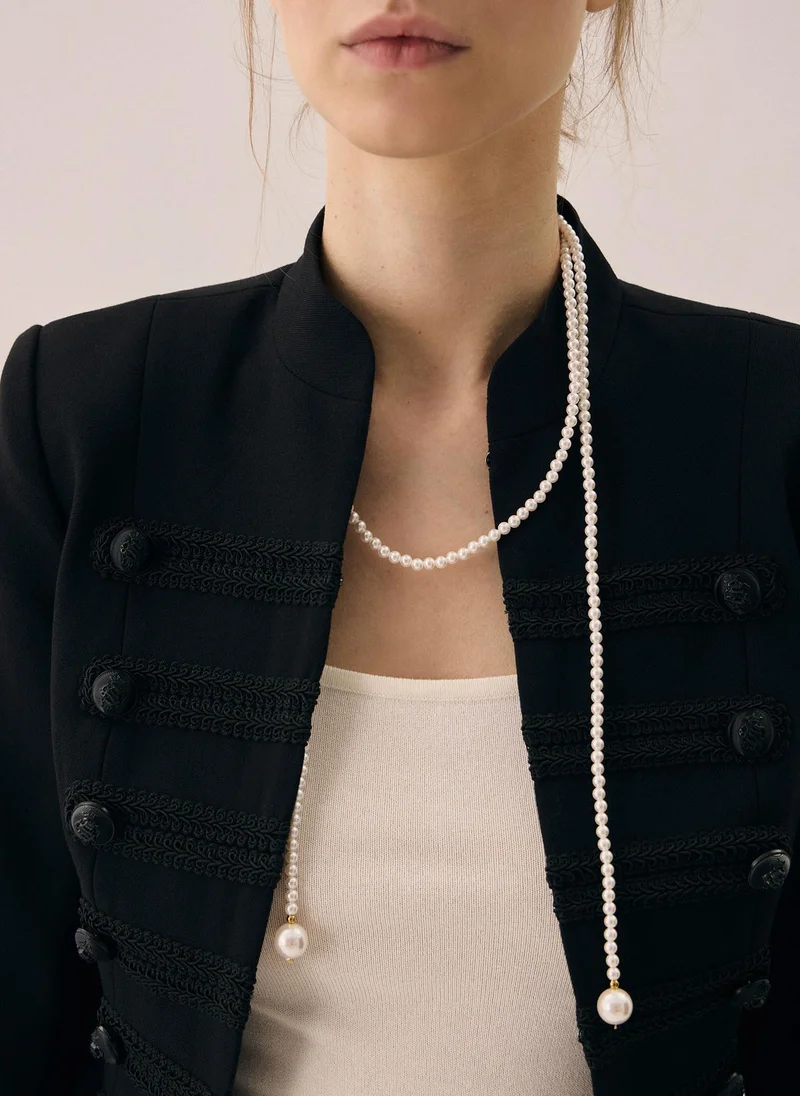 Long necklace made of small pearls