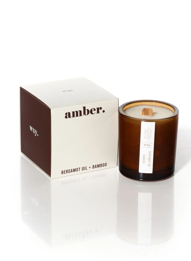 دبليو اكس واي شمعة آمبر ميني برائحة زيت البرغموت والخيزران