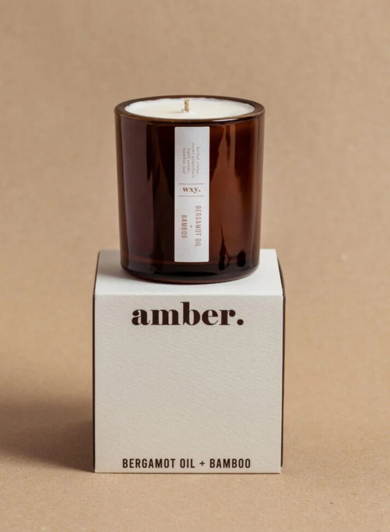 دبليو اكس واي شمعة آمبر ميني برائحة زيت البرغموت والخيزران