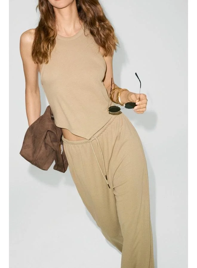 Ethiquet  GENTIANA Women's Halter Neck Asymmetric Skirt with Tapered and Wide-Legged Beige Top-and-Bottom Set. for Women | Best Price UAE