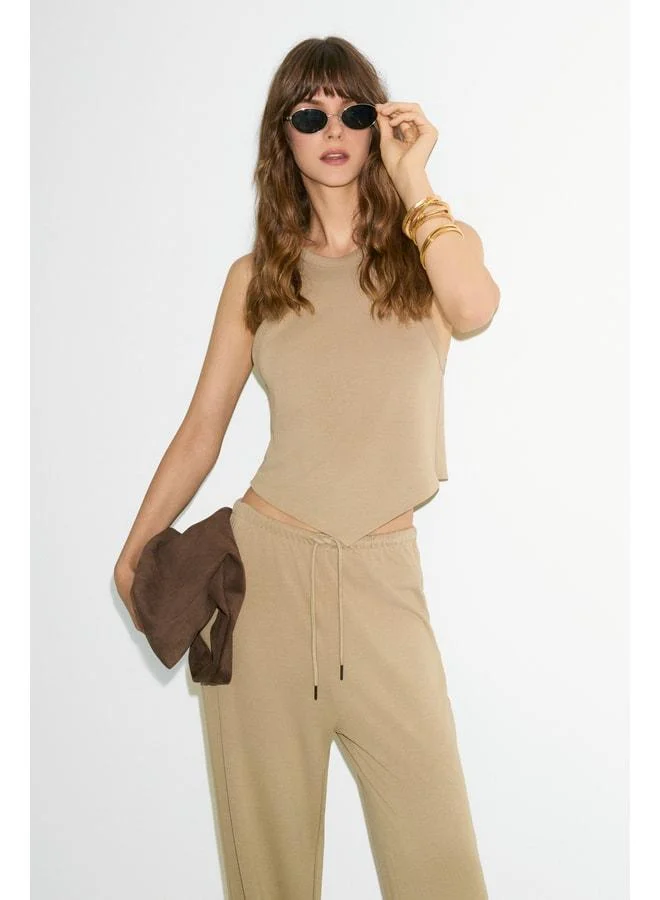 GENTIANA Women's Halter Neck Asymmetric Skirt with Tapered and Wide-Legged Beige Top-and-Bottom Set.
