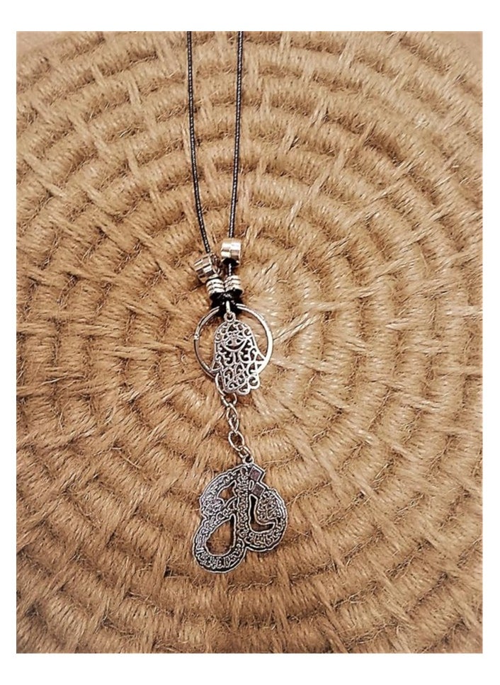 tag Car mirror hanger with a pendant in the shape of hands and a religious pendant 