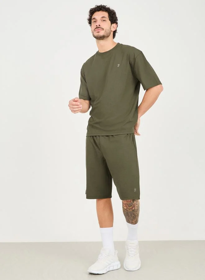 ستايلي Micro Pique Knit Reflective Logo Oversized Training Shorts