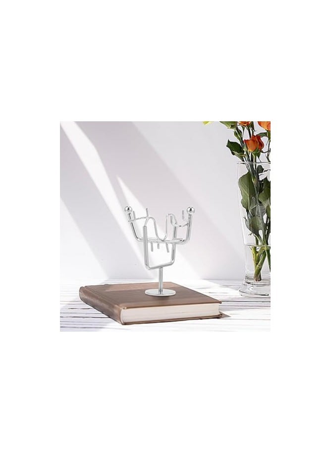 "Enjoy an experience of balance and calm with the Newton's Cradle - elegant design, smooth movement, and a clever decorative touch that adds a sophisticated scientific touch to your office or home. "
