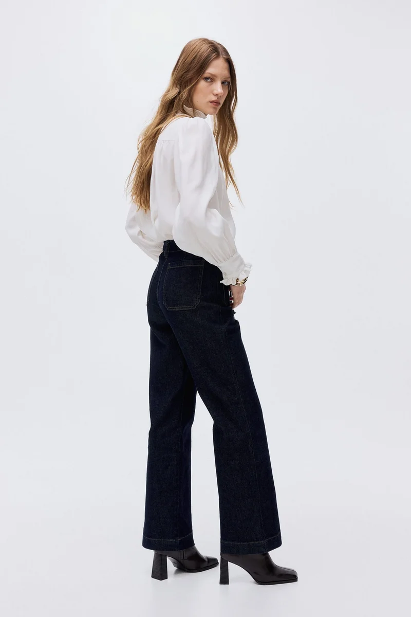 اتش اند ام جينز بحافة سفلية واسعة وخصر عالي