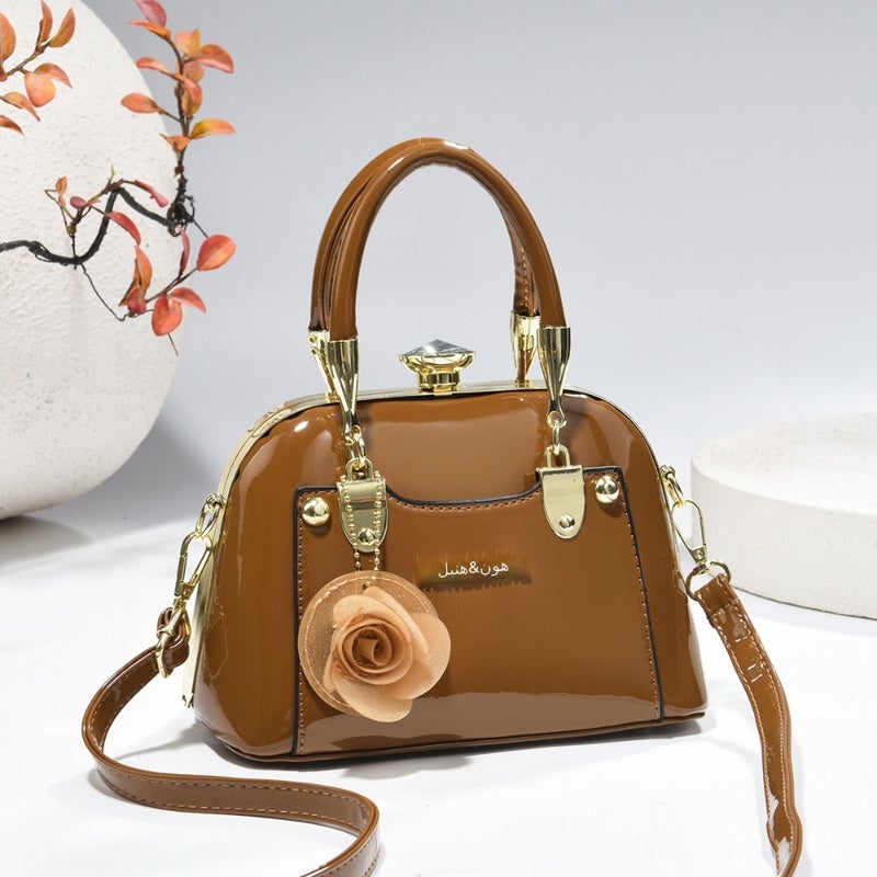 Steel armor mini shell bag, suitable for casual fashion, shiny surface, equipped with floral charm pendant, multi-functional handbag or cross-body bag, fashionable classic, lightweight and durable design - Image 4