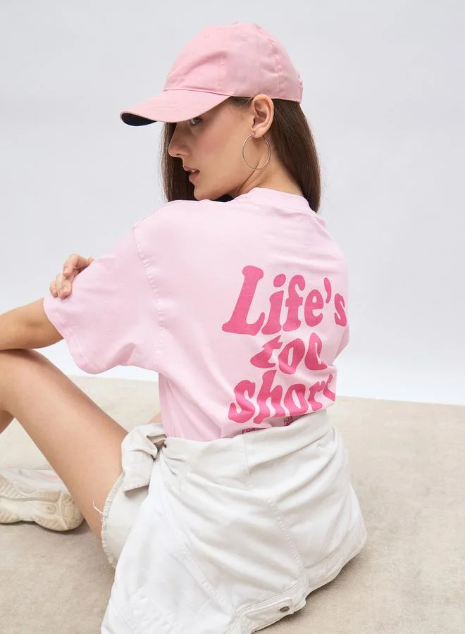 Styli Pink Styli Slogan Print Short Sleeve Oversized T-Shirt for Women | Best Price UAE