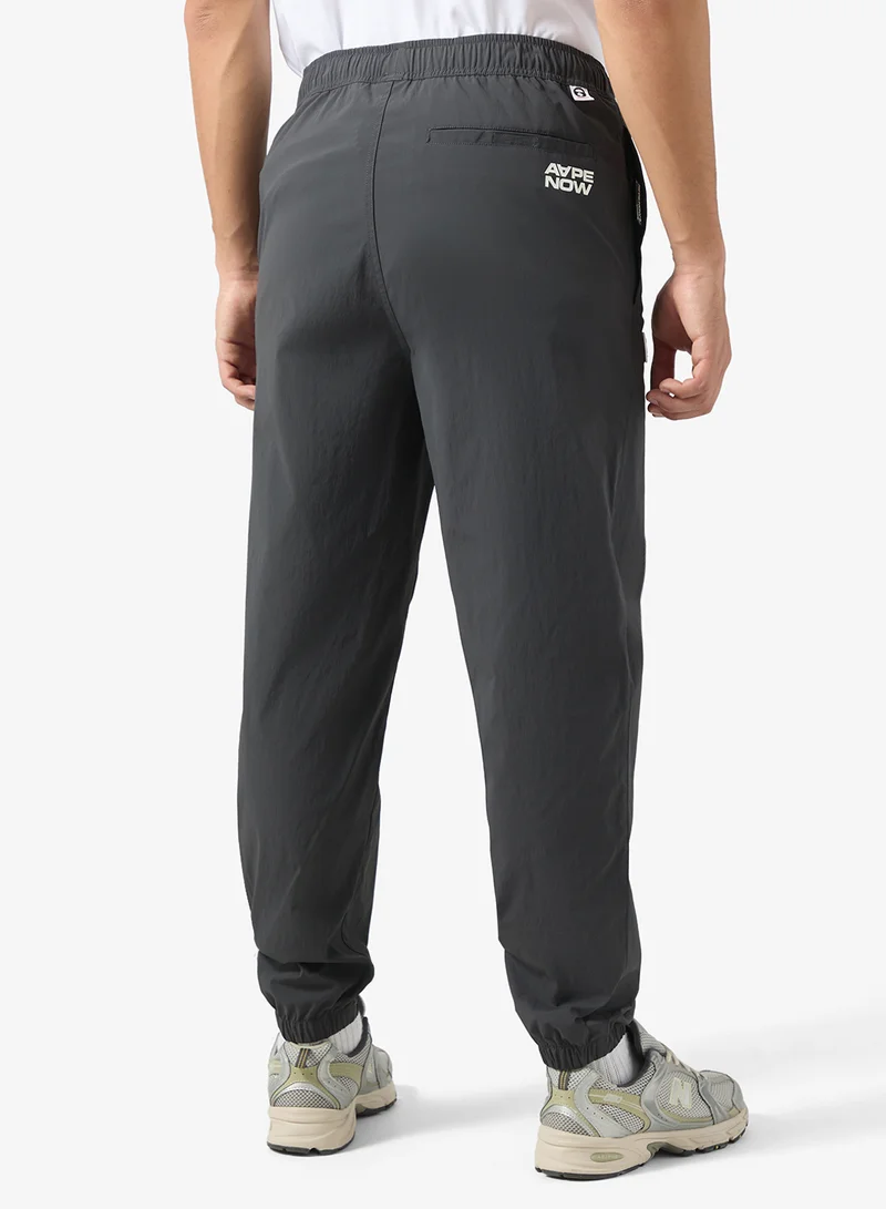 AAPE AAPENOW moonface logo jogger pants