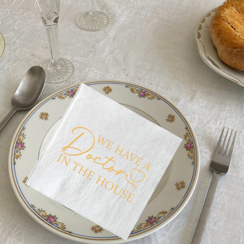 SWEETTALA We Have A Doctor In The House Napkins  50 Pack White and Gold Doctor Graduation Cocktail Napkins  Class of 2025 Medical School Graduation Party Supplies Decorations  3 Ply - Image 3
