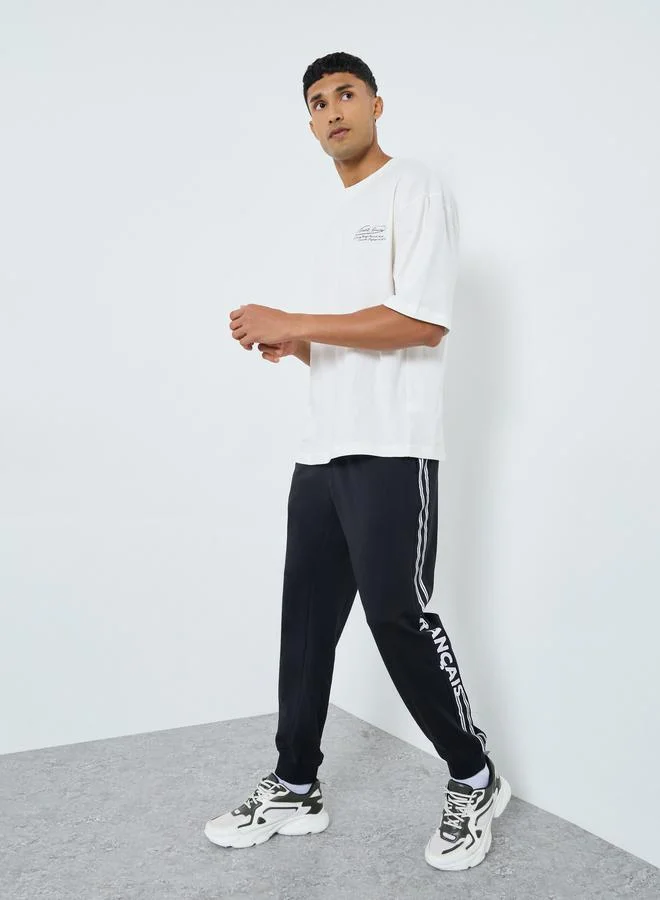 Styli Styli Men Black Slogan Print Joggers