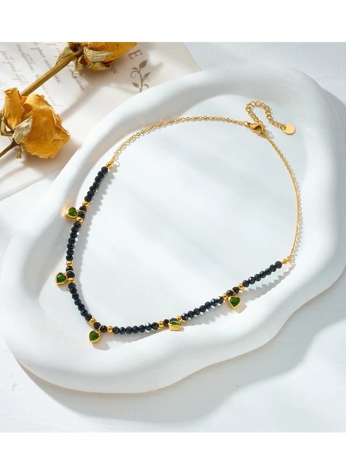 The Black Pearl Accessories - Stainless Steel Necklace Golden with Black Crystal Beads and Green Zircon hearts Pendants - Image 1