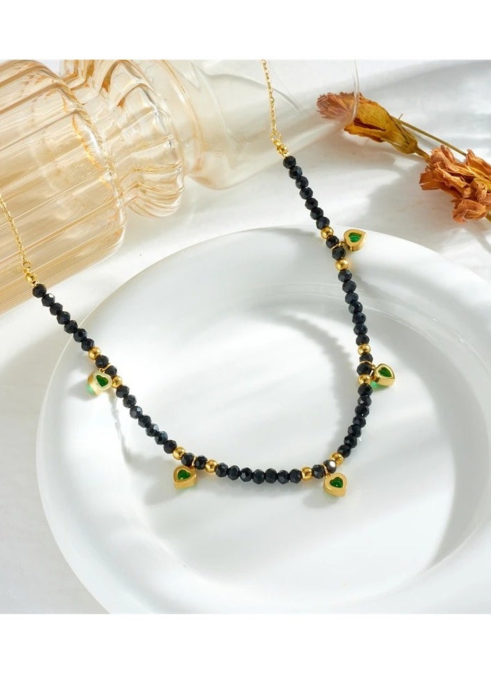 The Black Pearl Accessories - Stainless Steel Necklace Golden with Black Crystal Beads and Green Zircon hearts Pendants - Image 1