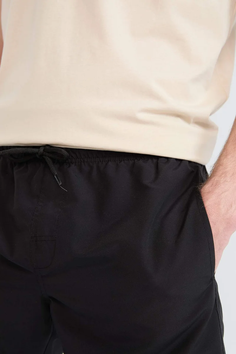 Defacto  Regular Fit Mesh Lined Lightweight Fabric Swim Shorts for Men | Best Price UAE