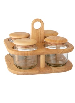 A Spice Set With A Rotating Stand Consisting of 4 Glass jars And A Tightly Closed Wooden Lid.