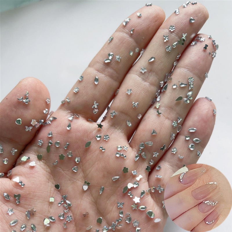 Sevgob 1000PCS Silver Mini Rhinestones Nail Art Charms Multi Shape Crystal Flat Back Nail Gems 3D Moon Heart Star Flower Nail Diamonds Kawaii Nail Crafts Acrylic Nail Rhinestone for Women Girls DIY Manicure - Image 1