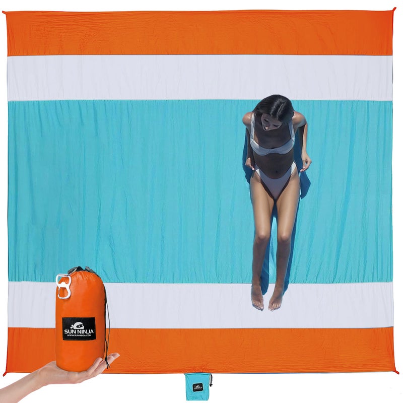 SUN NINJA Sand Proof Beach Blanket - Sand Free Beach Mat, Lightweight & Quick Dry Beach Essentials with Travel Bag, Giant Beach Blanket (10'x9') Perfect for Outdoors, Picnic, Camping & Travel - Image 1