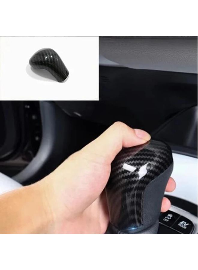 غطية غلاف ذراع ناقل الحركة من ألياف الكربون لتويوتا كامري كورولا كروس E210 2019 2024 - Image 1
