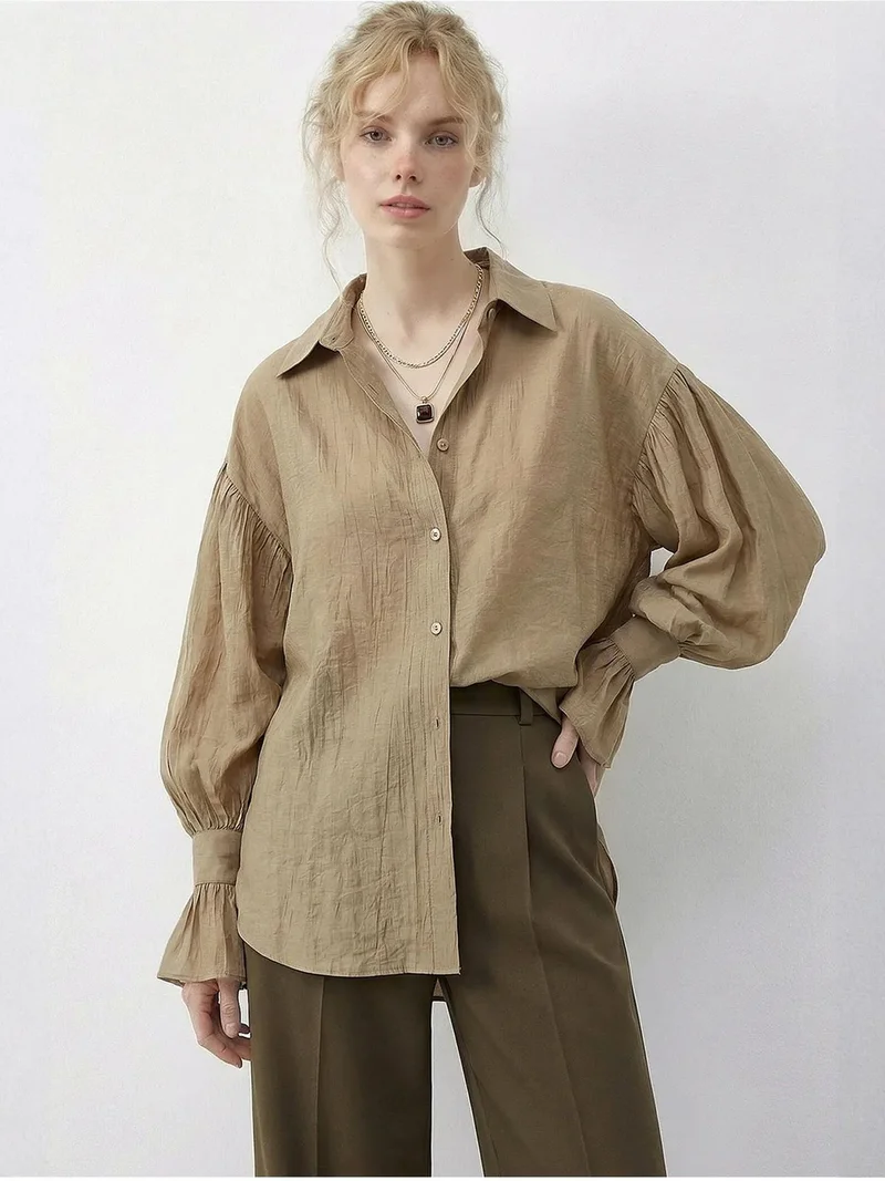 بيانكو لوتشي LUCCI Oversized Frilly Button-Up Shirt