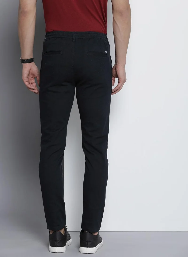 ذا انديان كراج كو Men Slim Fit Solid Mid-Rise Chinos
