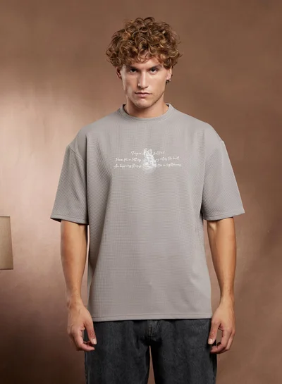 Campus Sutra Campus Sutra Men's Coin Grey Boxy Mytho-Modernism T-Shirt For Casual Wear | Crew Neck | Short Regular Sleeves | Pull On Closure | T-Shirt Crafted With Comfort Fit For Everyday Wear