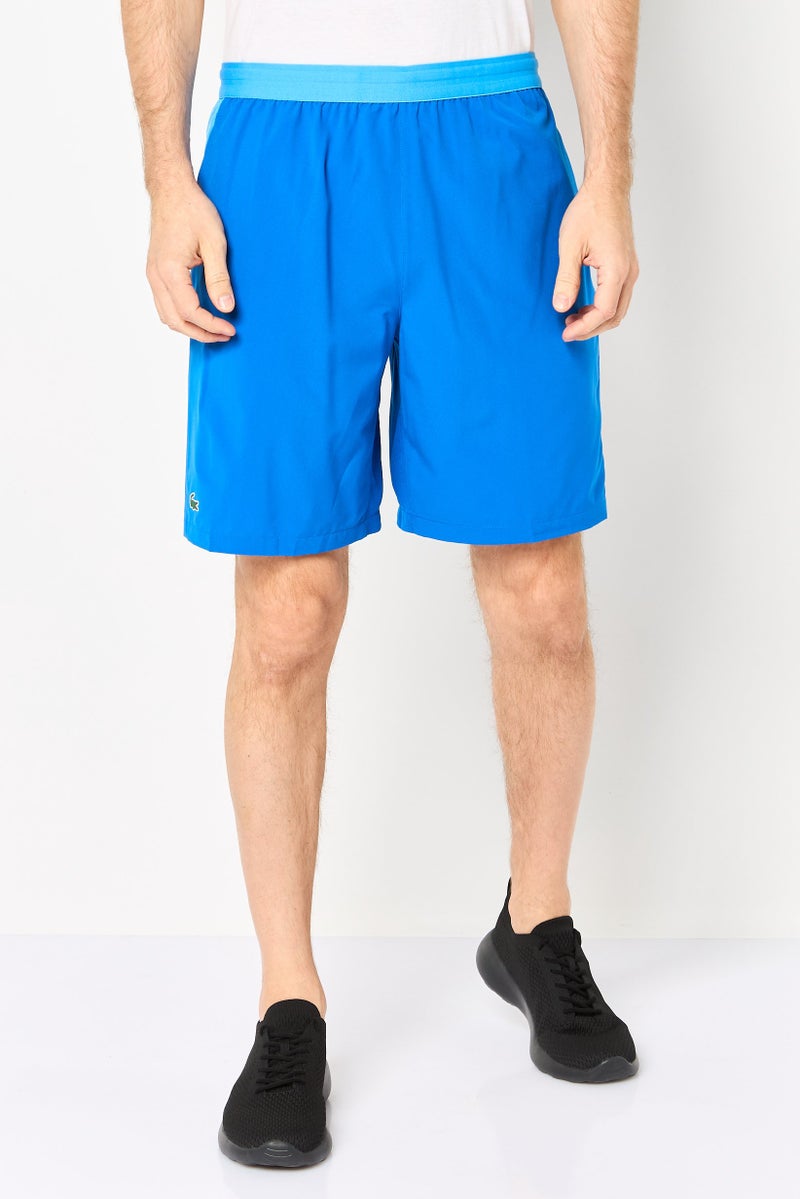 LACOSTE Men Sportswear Fit Novak Djokovic Tennis Shorts, Royal Blue - Image 1