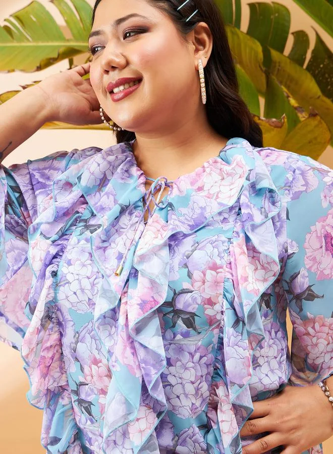 SASSAFRAS Plus Floral Print Top with Tie-Up Neck and Ruffled Detail by Styli