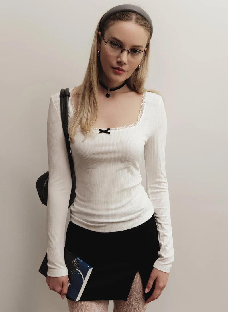 Lichi Textured jersey top with openwork and bow detailing