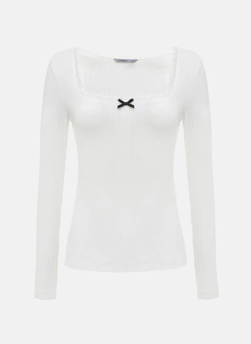 Lichi Textured jersey top with openwork and bow detailing