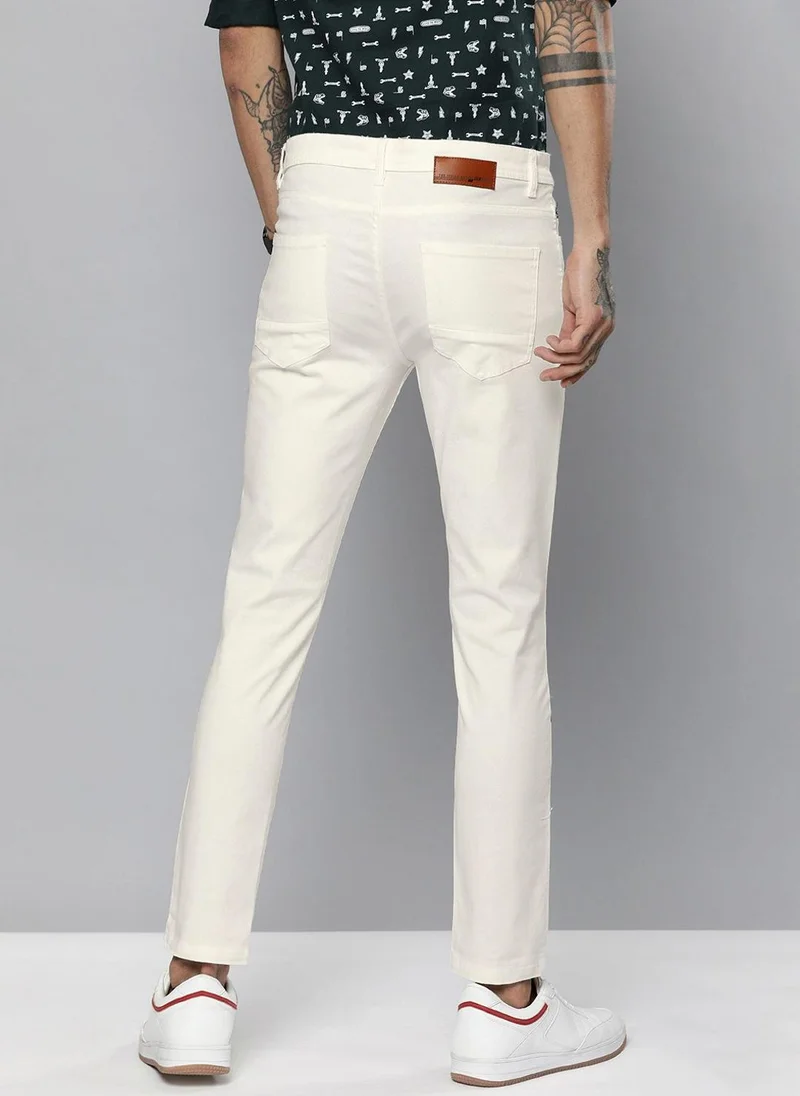 ذا انديان كراج كو Men Slim Fit Solid Mid-Rise Chinos