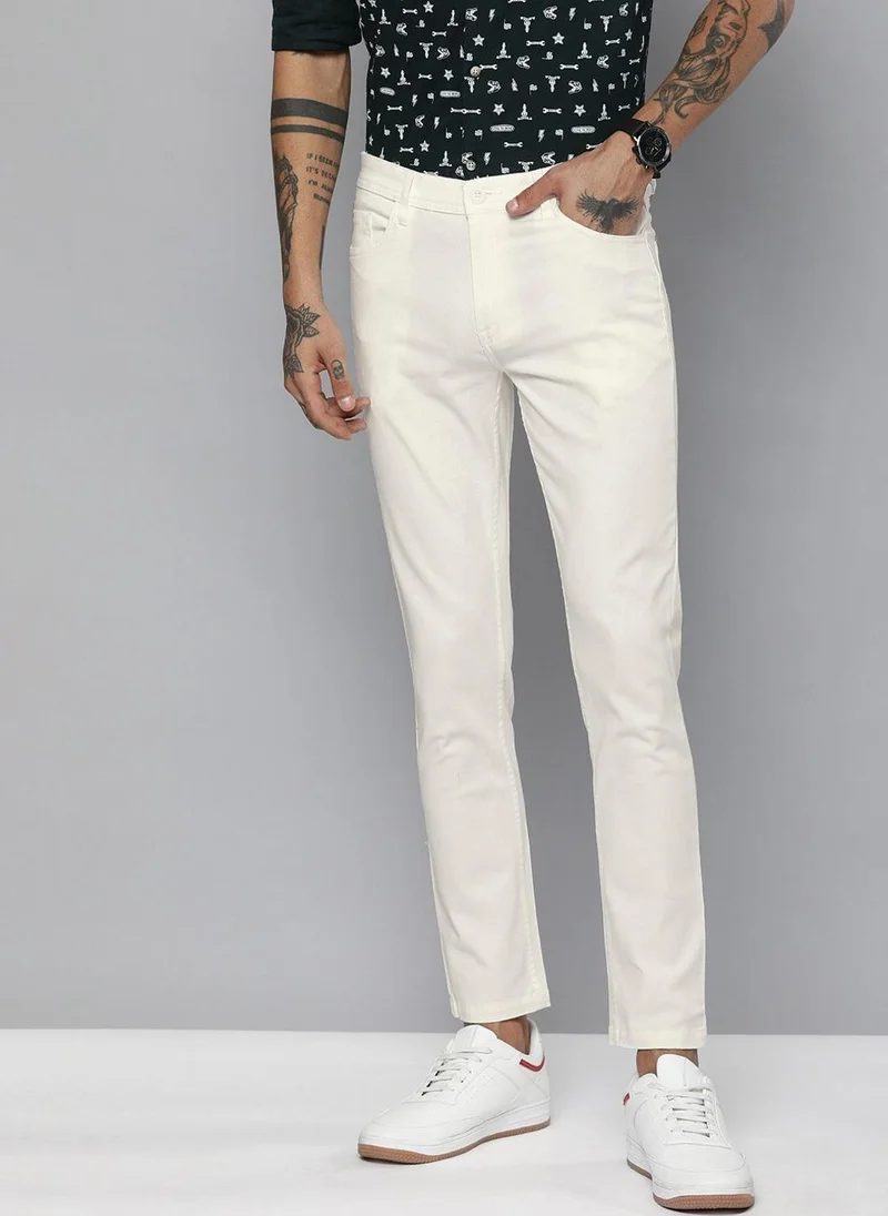 ذا انديان كراج كو Men Slim Fit Solid Mid-Rise Chinos