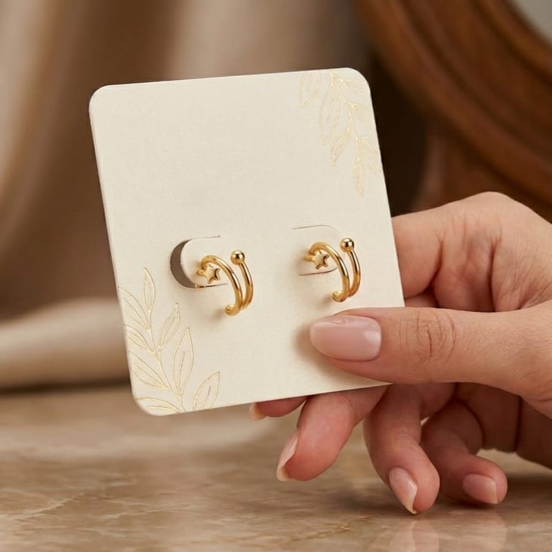 These elegant gold earrings, featuring a double design adorned with a delicate star and a sparkling, prominent ball, offer exceptional luxury. They require no ear piercing for easy wear and all-day comfort. - Image 4
