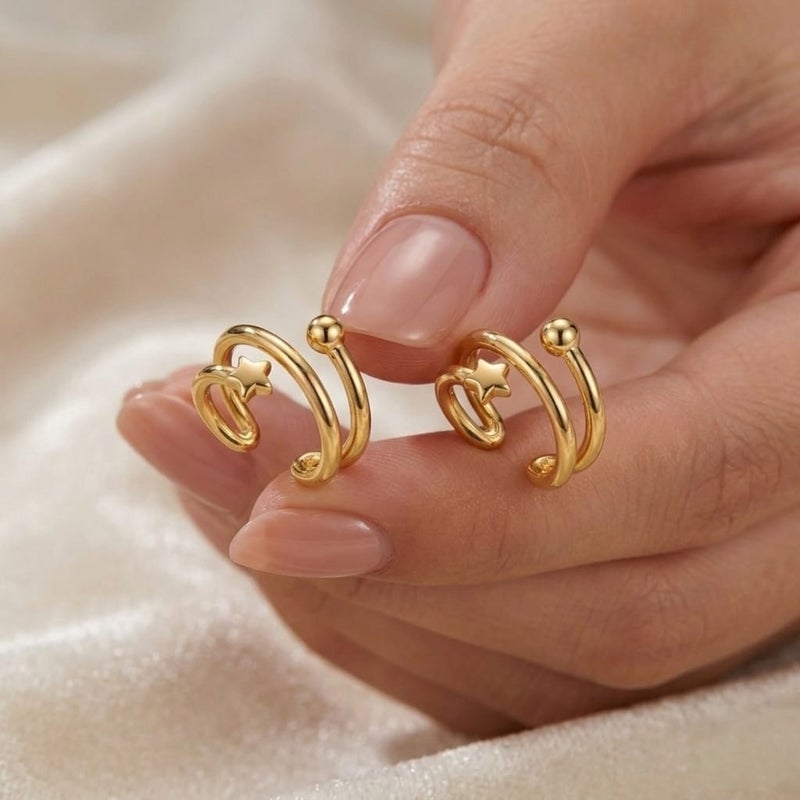 These elegant gold earrings, featuring a double design adorned with a delicate star and a sparkling, prominent ball, offer exceptional luxury. They require no ear piercing for easy wear and all-day comfort. - Image 3