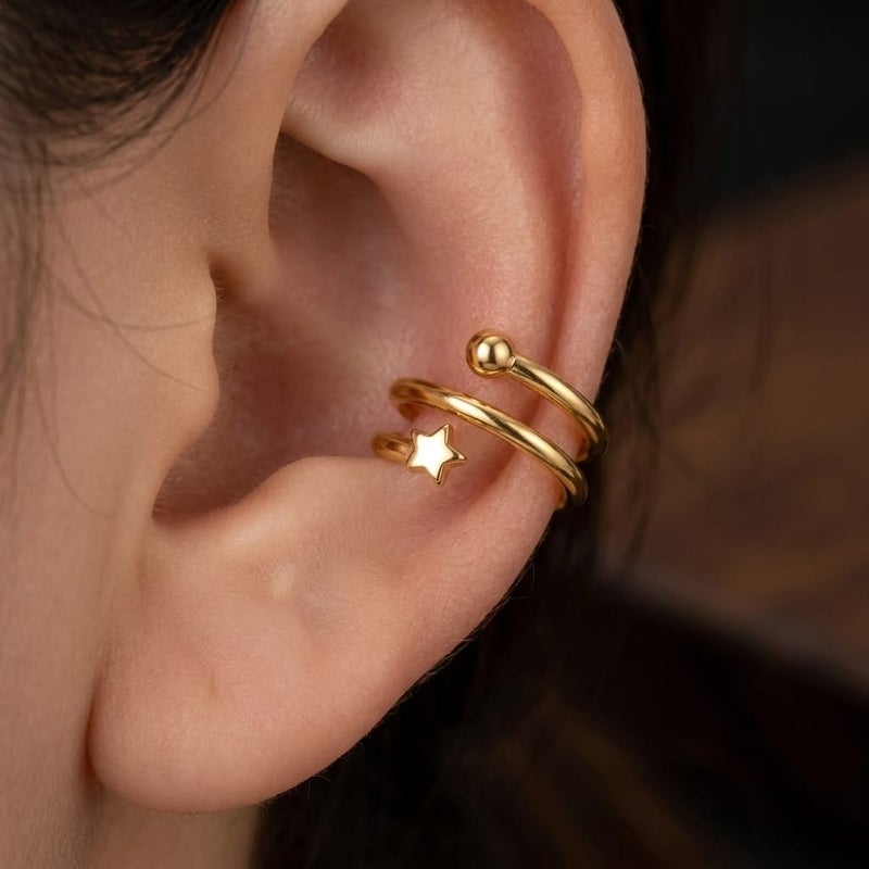 These elegant gold earrings, featuring a double design adorned with a delicate star and a sparkling, prominent ball, offer exceptional luxury. They require no ear piercing for easy wear and all-day comfort. - Image 2