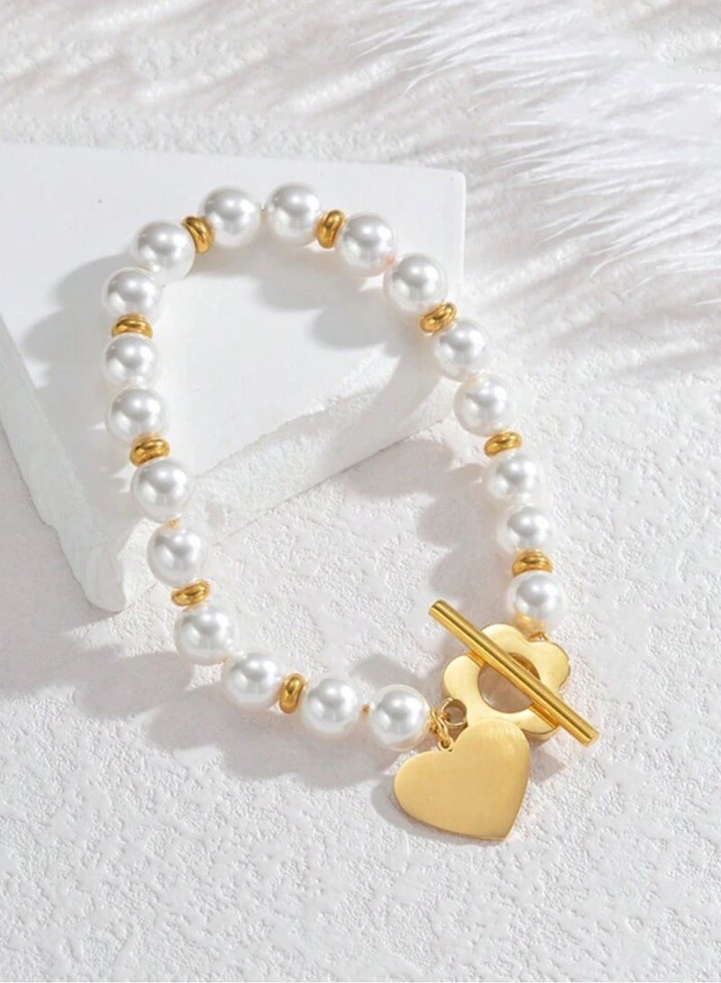 إيكوال اسوارة نسائية من الاستانلس ستيل باللون الذهبي واللؤلؤ بتصميم عصري وأنيق - Image 1