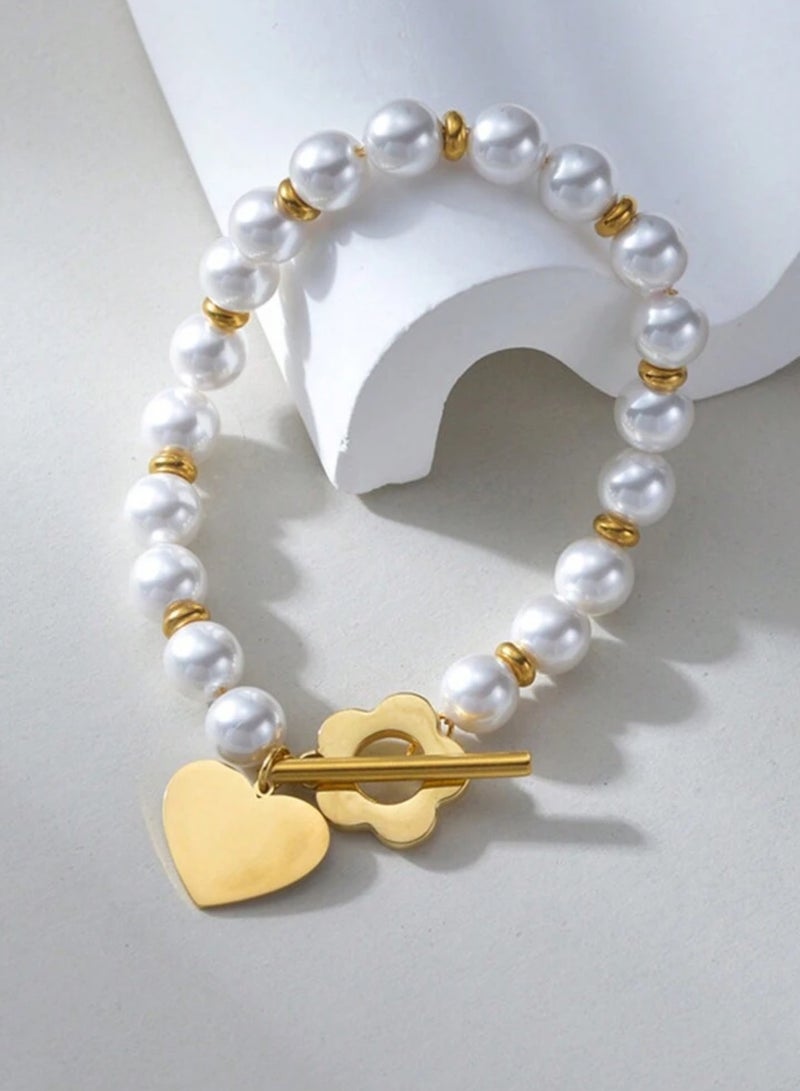 إيكوال اسوارة نسائية من الاستانلس ستيل باللون الذهبي واللؤلؤ بتصميم عصري وأنيق - Image 3