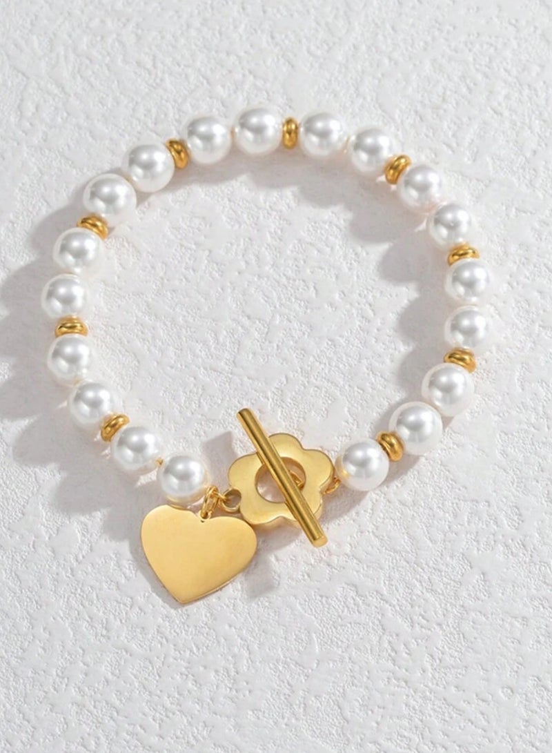 إيكوال اسوارة نسائية من الاستانلس ستيل باللون الذهبي واللؤلؤ بتصميم عصري وأنيق - Image 2