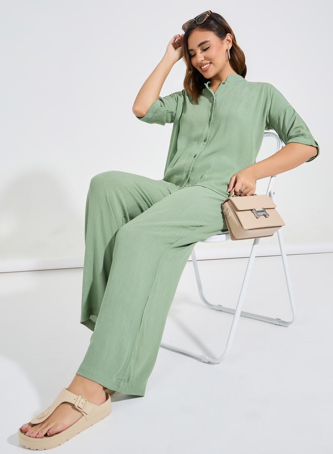 A coordinated set of wide-leg trousers with a boxy...