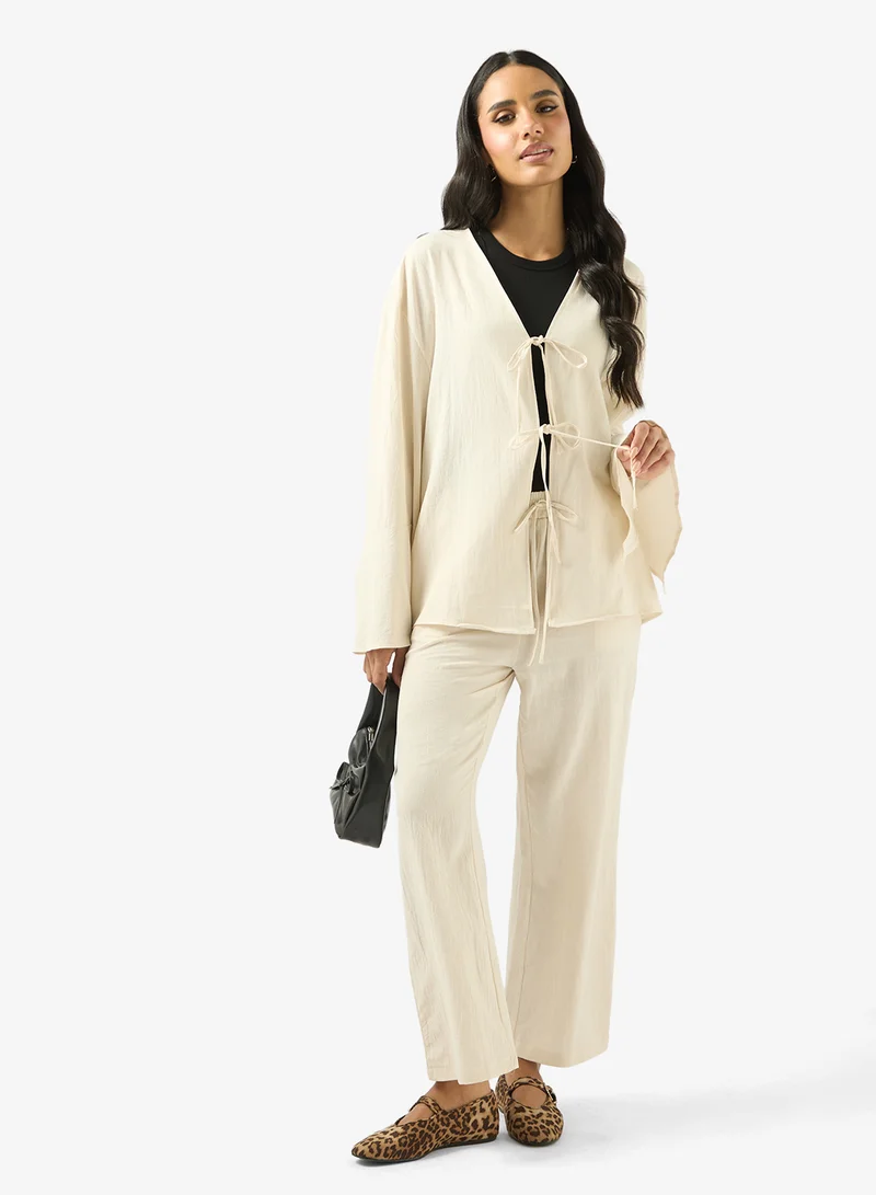 جينجر طقم بلوزة وبنطلون بقصة مريحة ورباط