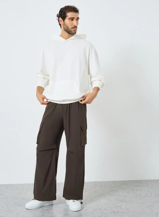 Styli Women Brown Plain Oversized Parachute Pants with Utility Pockets