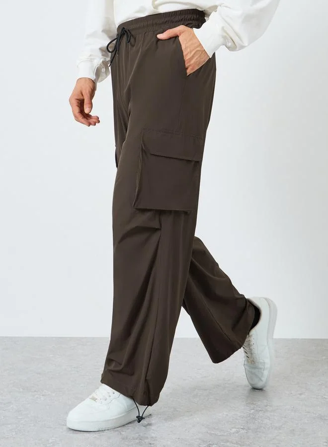 Styli Women Brown Plain Oversized Parachute Pants with Utility Pockets